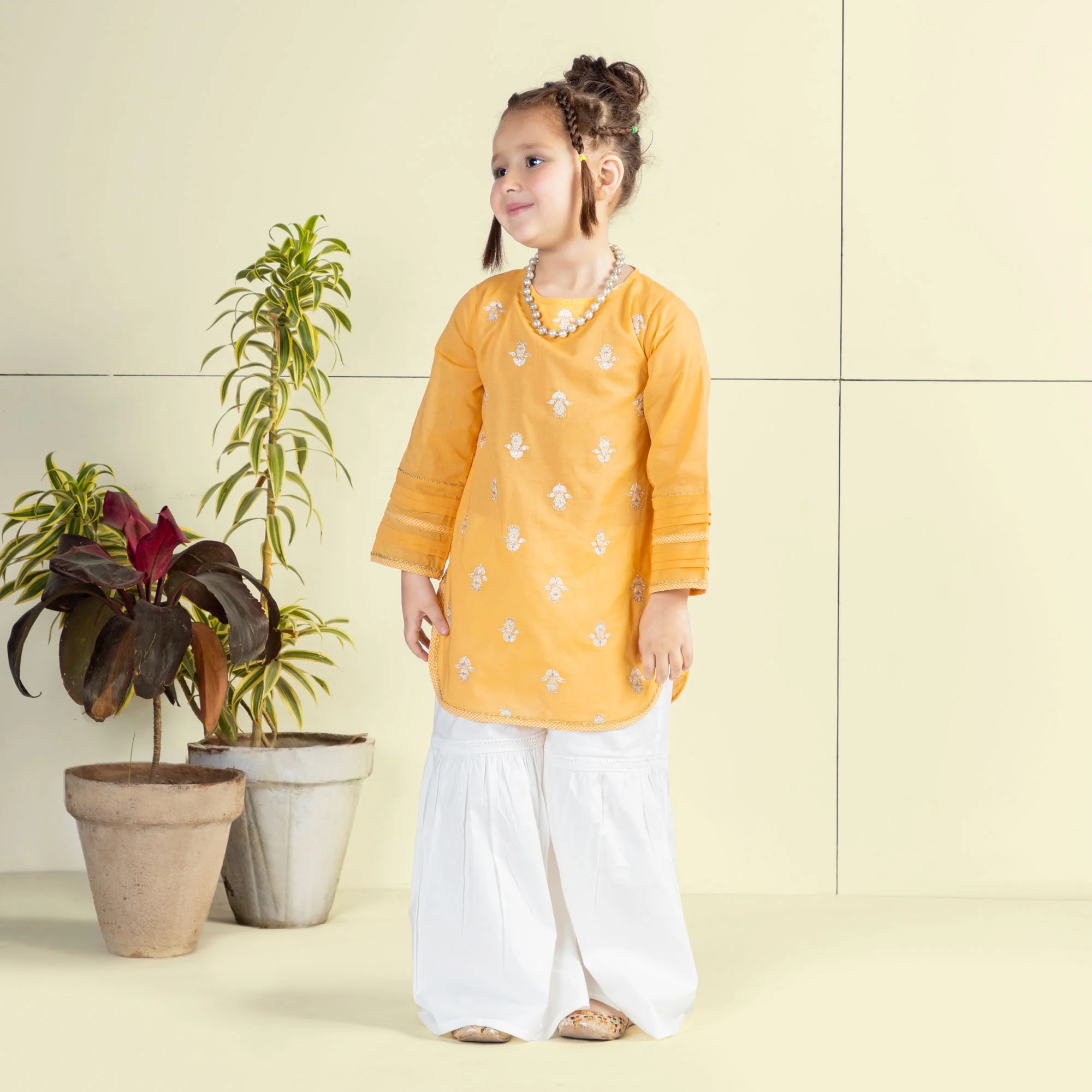 Lustrous Yellow Embroidered Kurti